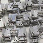 Low volume CNC manufacturing guide: rising categories (spinal implants, surgical robotics, satellites, EV), data, tolerances, and how to bridge the MOQ gap.