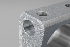 Bead blasting is a CNC surface finishing process that uses glass beads or ceramic media to create a uniform matte texture. It removes minor machining marks, improves surface consistency, and enhances coating adhesion. This finish is commonly applied to aluminum, stainless steel, and titanium parts used in aerospace, automotive, and consumer electronics.