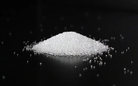 The most common bead blasting method for CNC machining. Uses spherical glass beads to create a smooth, satin-like finish without significantly damaging the part surface.