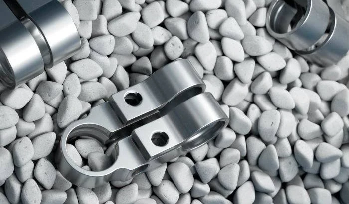 Tumbling finish is a mechanical surface finishing process that uses abrasive media and controlled movement to deburr, smooth, polish, and round edges on CNC machined parts. It removes sharp edges and minor surface imperfections while creating a more uniform surface finish with minimal dimensional impact.